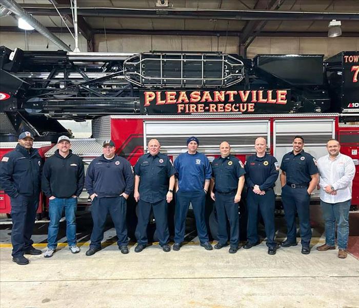 Local Firefighters in front of fire truck